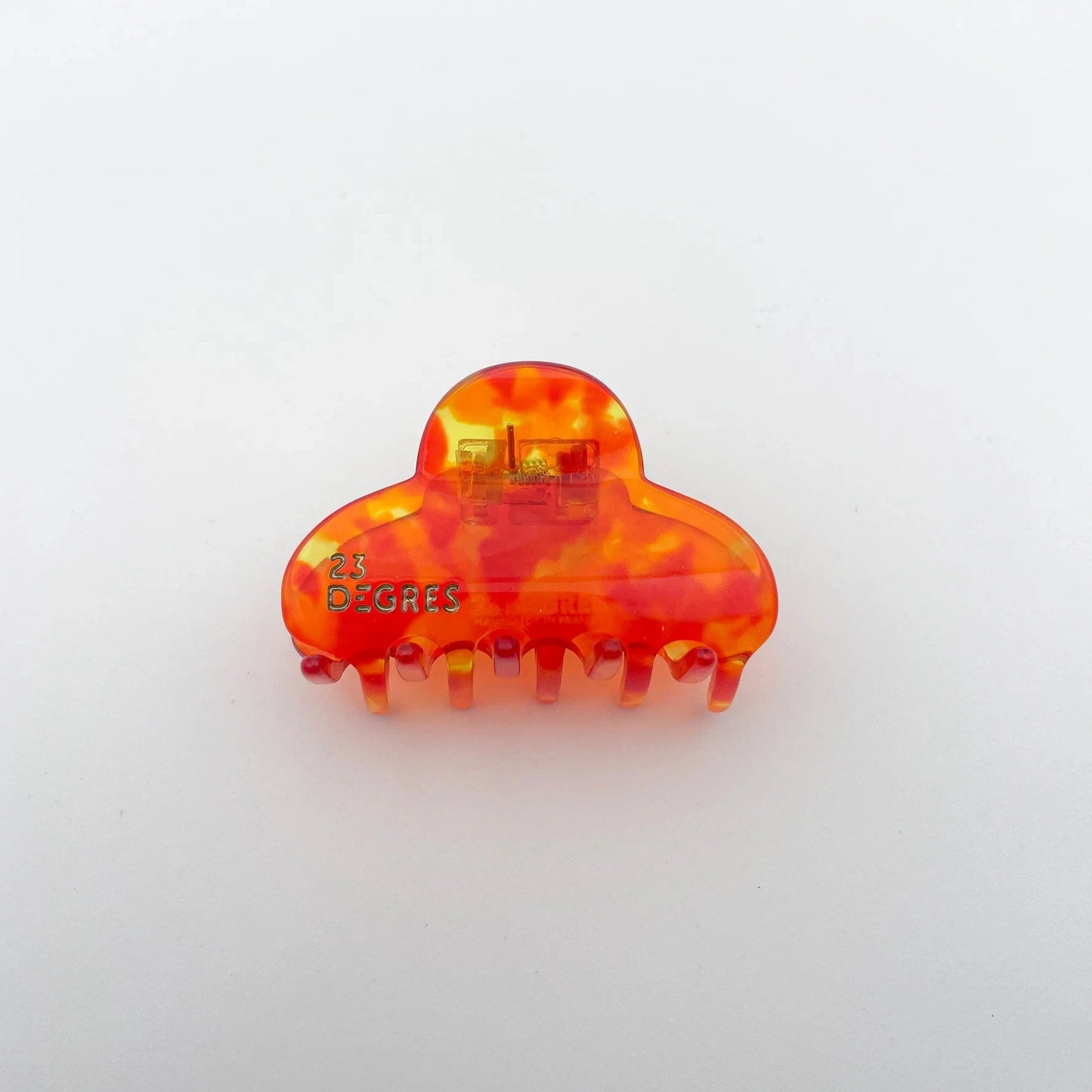 Petite pince à cheveux en forme de nuage à motifs écaille, coloris orange.