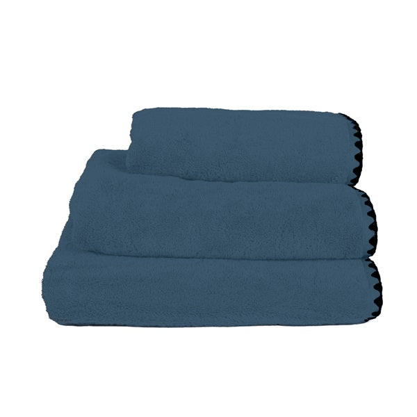 Serviettes d'invités en éponge, modèle Issey, coloris bleu turquin.
