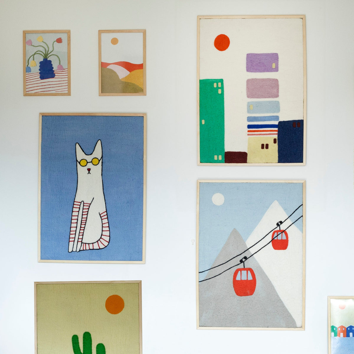 Tableaux feutrés en laine, différentes illustrations.
