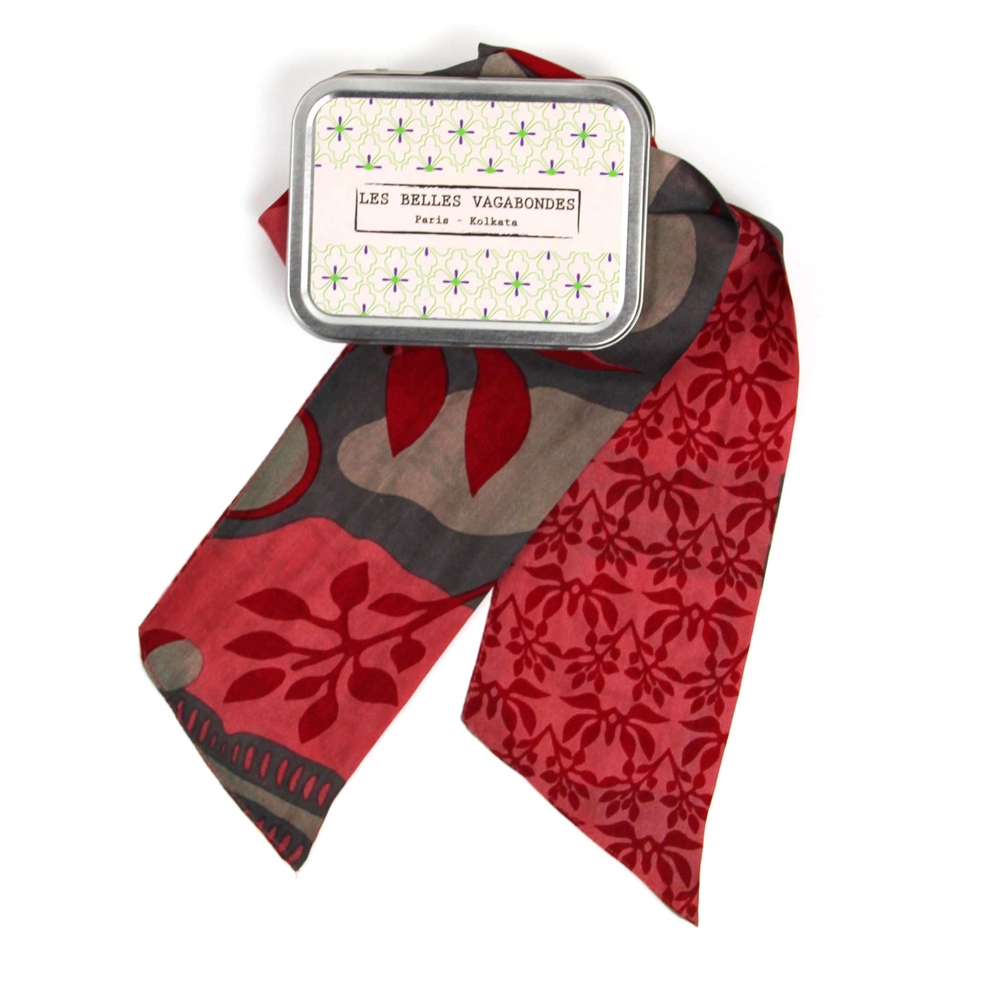 Bandeau en soie avec un motif végétal et organique, dans les tons rose, rouge, écru et taupe.