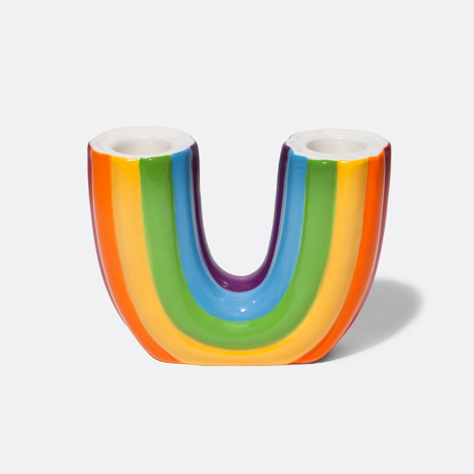 Bougeoir double en céramique en forme d'arc-en-ciel renversé.