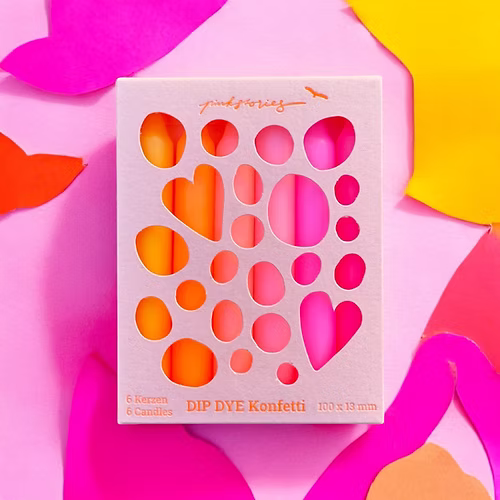 Lot de 6 bougies fines, dégradé du rose au jaune, dans leur packaging.