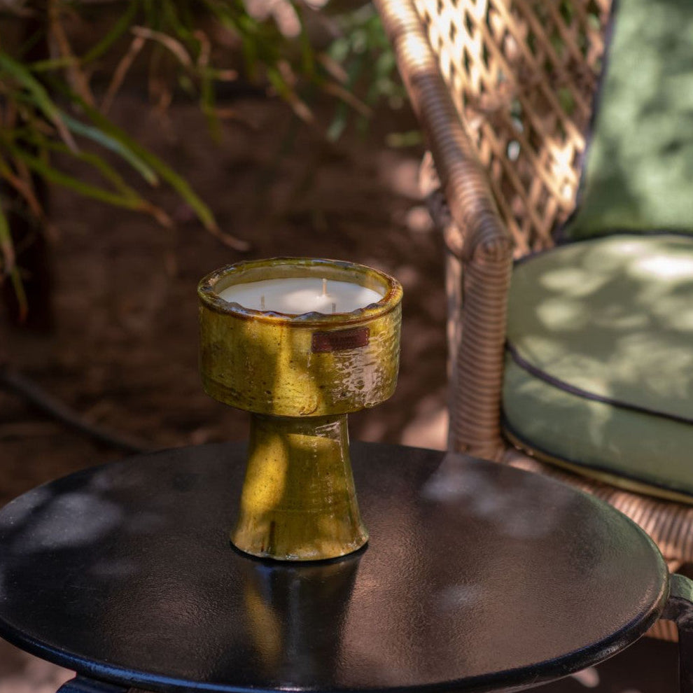 Bougie dans une coupe en poterie tamegroute jaune.