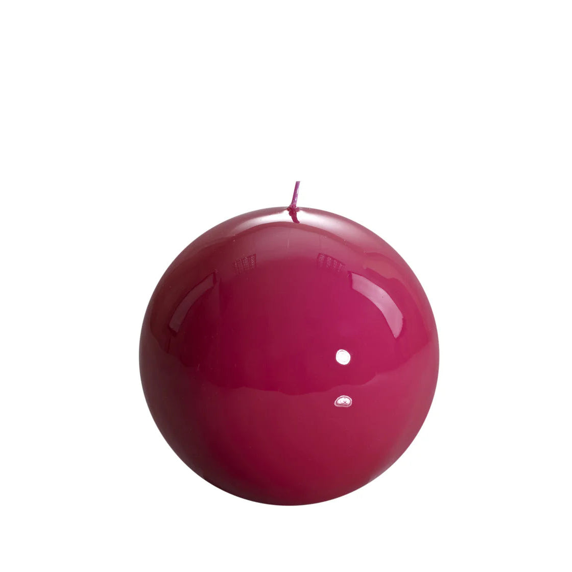 Bougie ronde brillante, coloris rose fuchsia. 