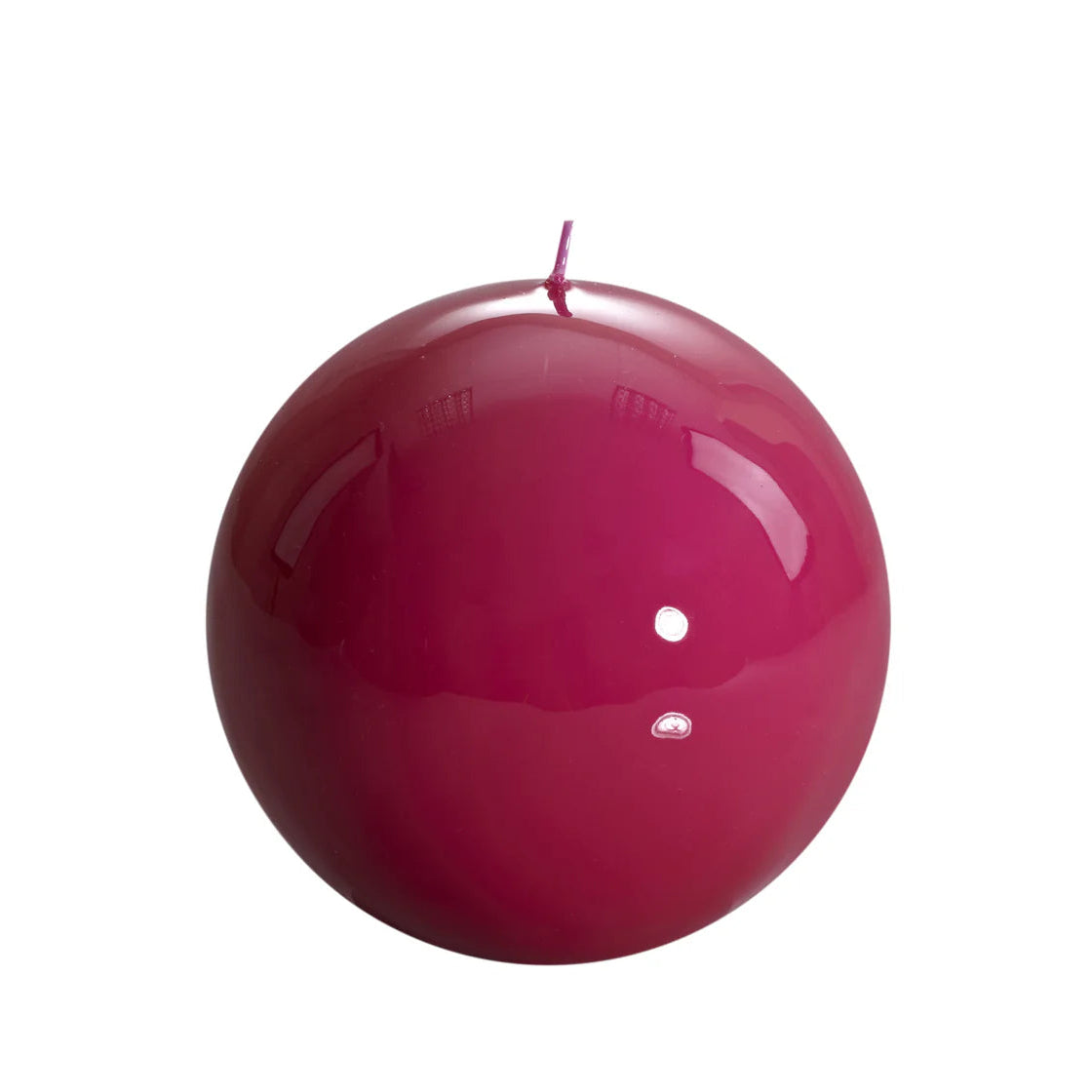 Bougie ronde brillante, coloris rose fuchsia. 