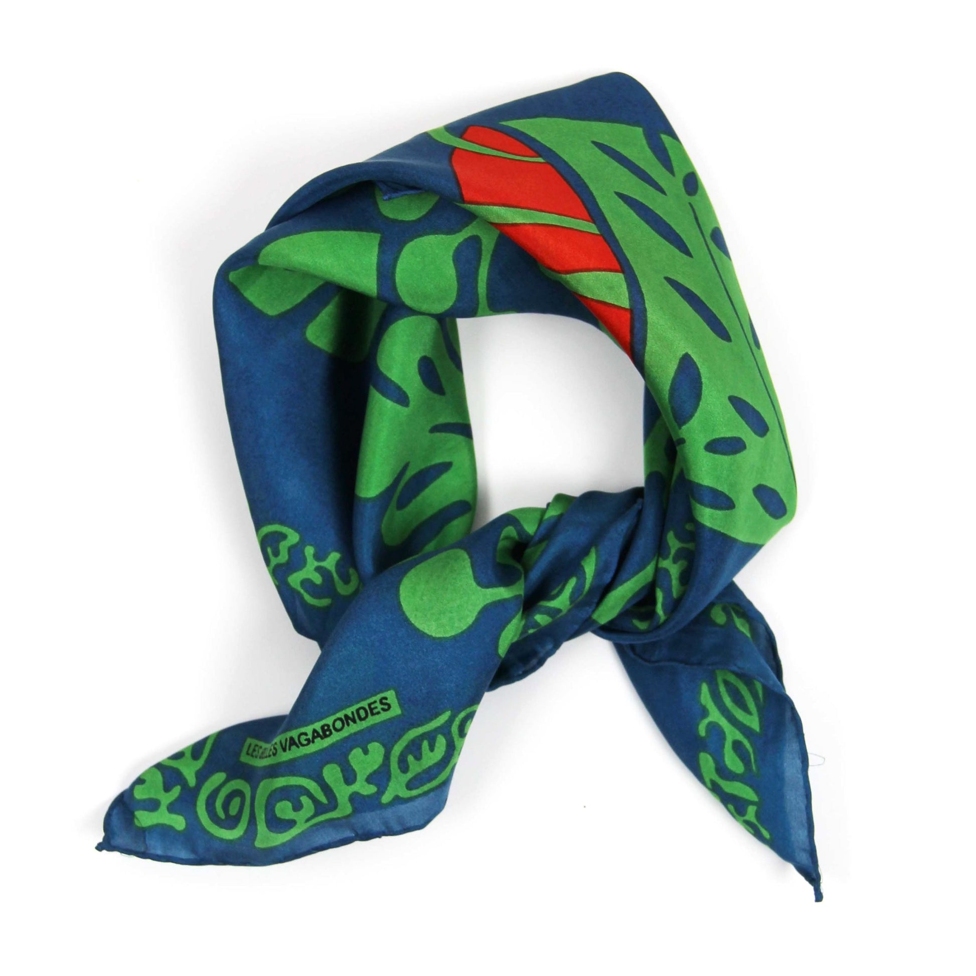 Foulard carré en soie avec dessin d'une plante de type Arum , dans les tons vert, bleu et orange. 