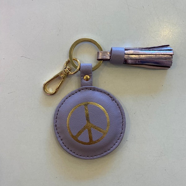 Porte clés en cuir trop funs avec un joli pompon