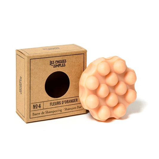 Shampoing solide massant, parfum Fleurs d'Oranger, coloris orange.