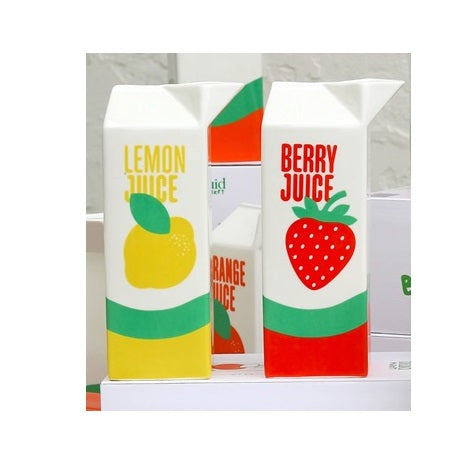Salière et poivrier en forme de JUS DE FRUITS de chez FLUID MARKET