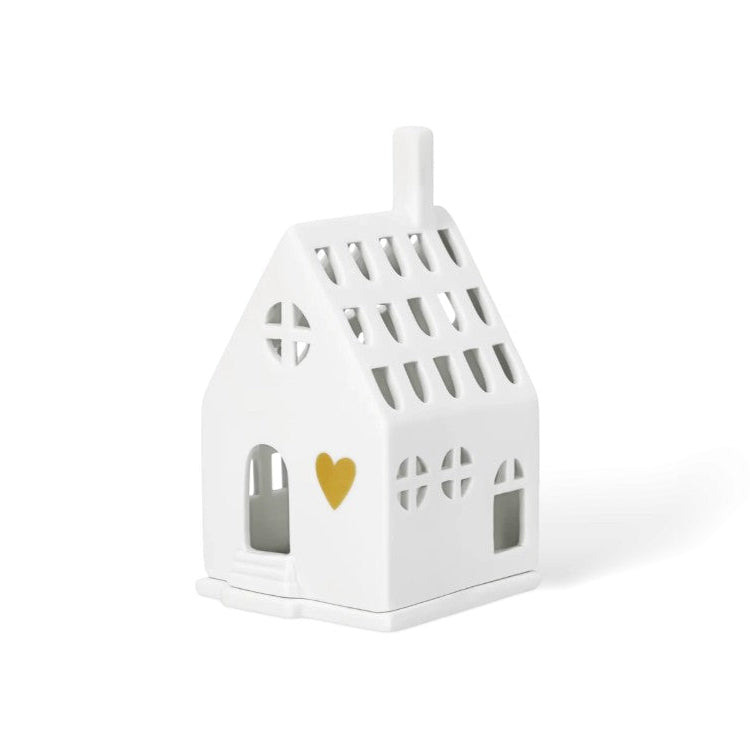 Photophore en porcelaine blanche ajourée en forme de maison, avec un coeur doré en façade.