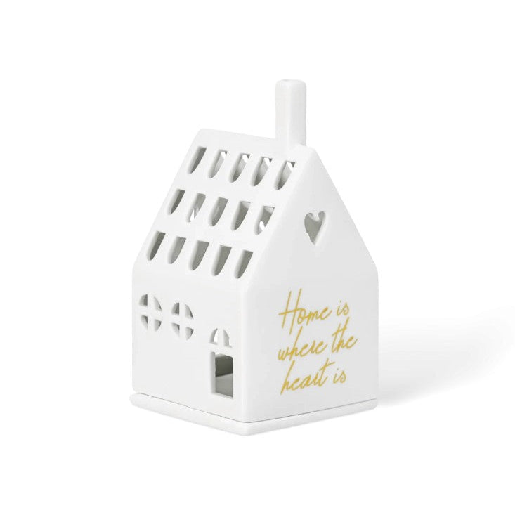 Photophore en porcelaine blanche ajourée en forme de maison, avec une citation en façade : "Home is where the heart is". 