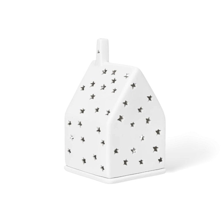 Photophore en porcelaine en forme de maison avec les façades étoilées.