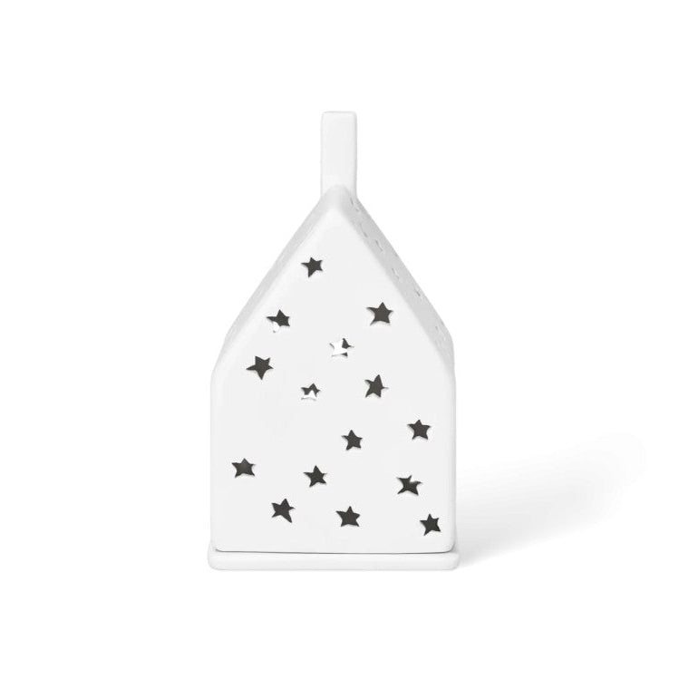 Photophore en porcelaine en forme de maison avec les façades étoilées.
