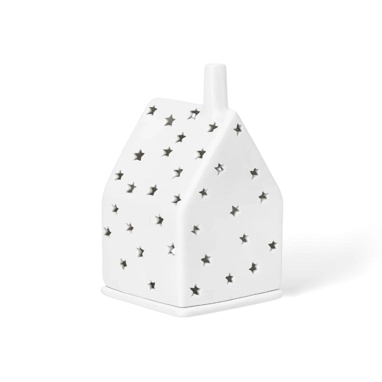 Photophore en porcelaine en forme de maison avec les façades étoilées.