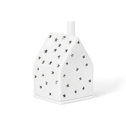 Photophore en porcelaine en forme de maison avec les façades étoilées.