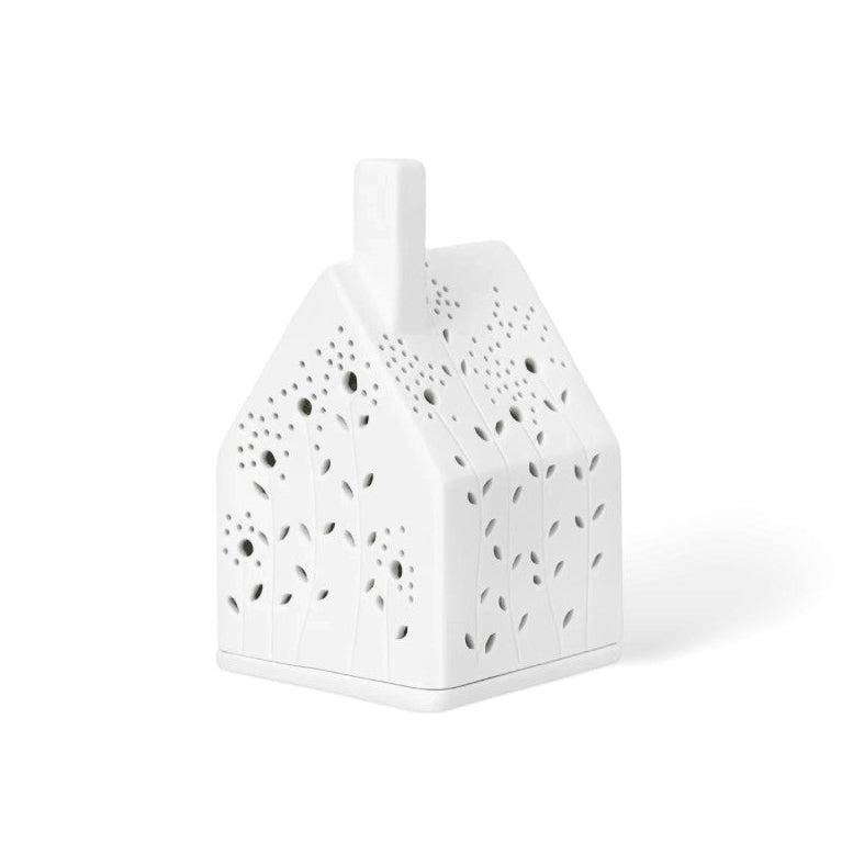 Photophore en porcelaine ajourée en forme de maison, avec façades fleuries.