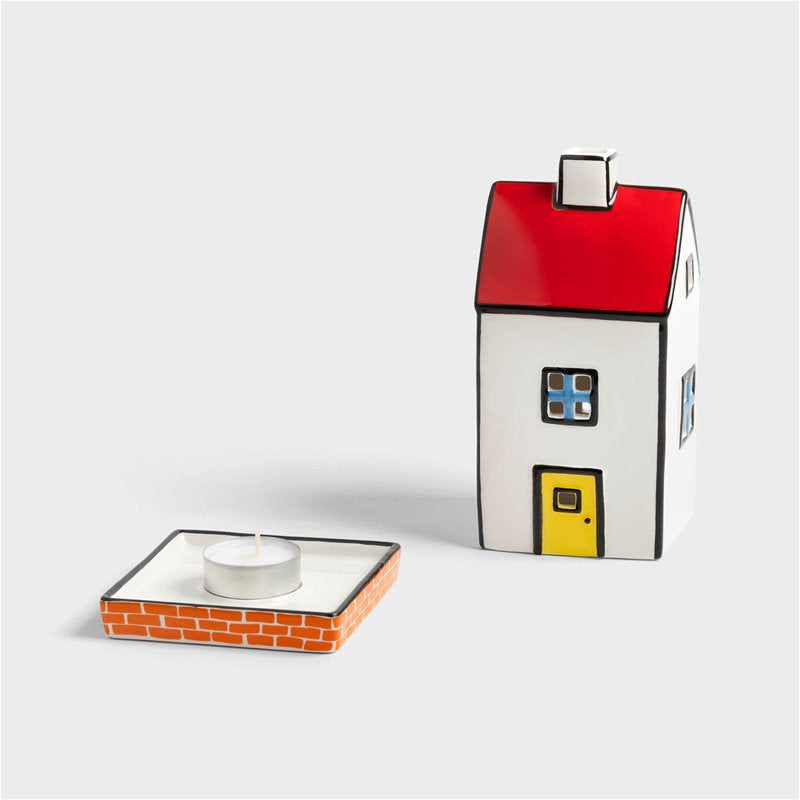 Photophore en forme de cottage anglais avec les arrêtes soulignées d'un trait noir et dans les tons blanc, rouges, jaunes et bleu.