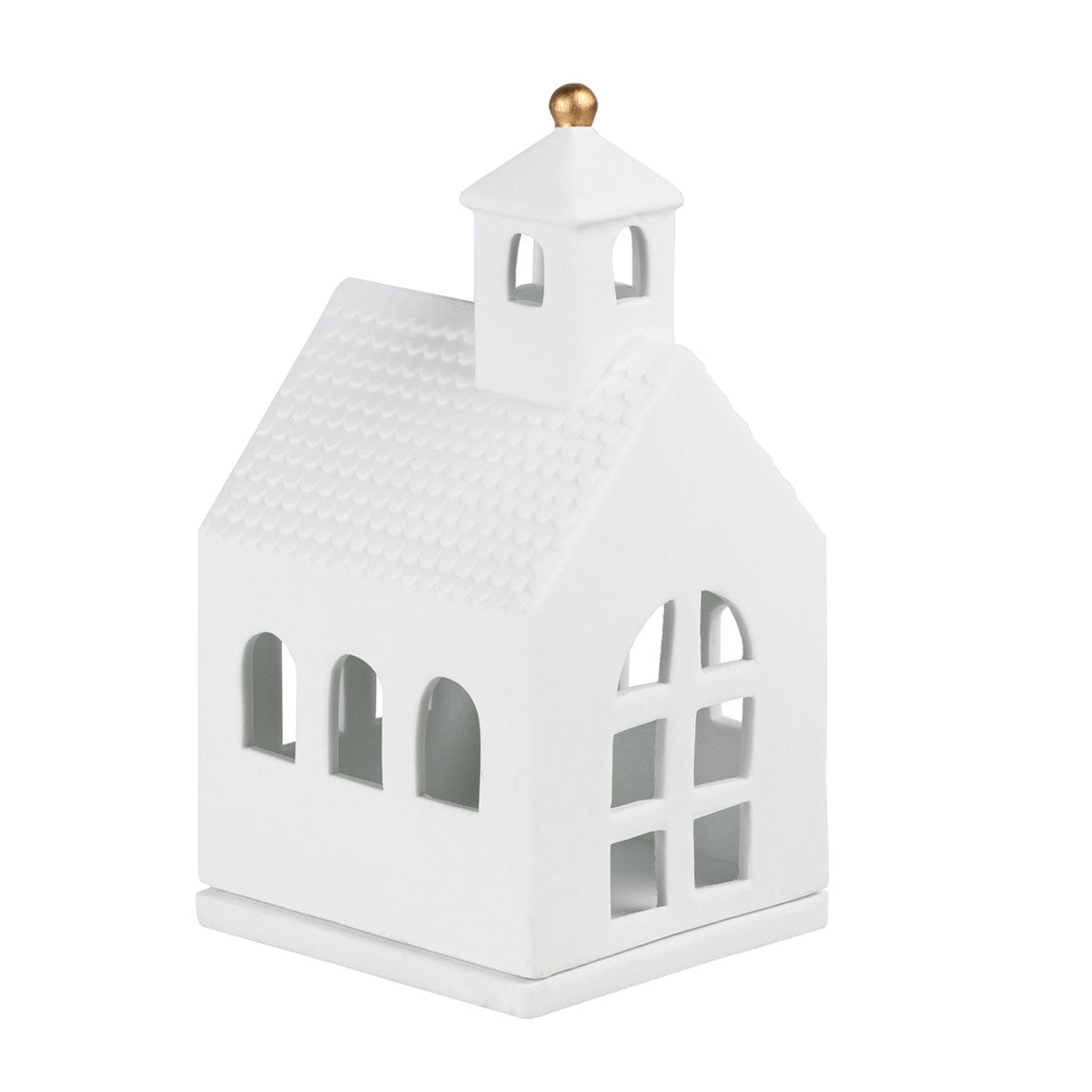 Photophore en porcelaine blanche en forme de petite chapelle.