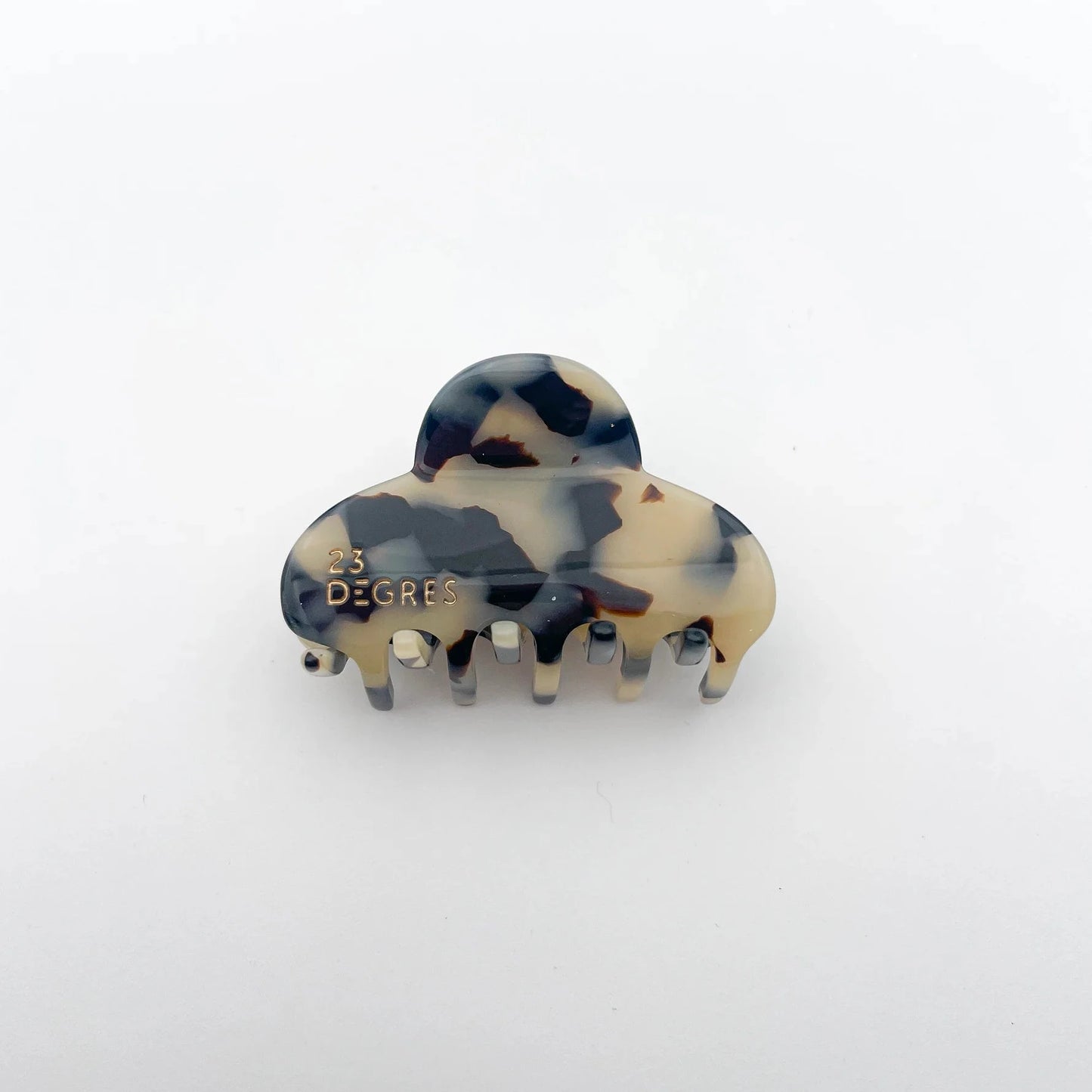 Petite pince à cheveux en forme de nuage à motifs écaille beige.