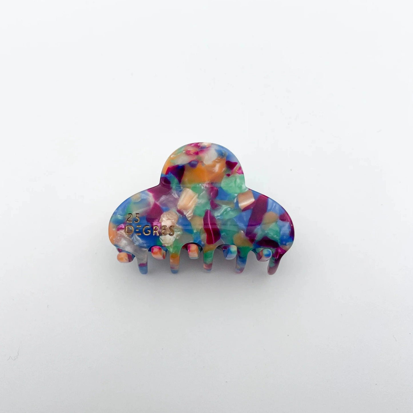 Petite pince à cheveux en forme de nuage à motifs écaille, coloris multicolore, dans les tons bleus, roses et oranges.