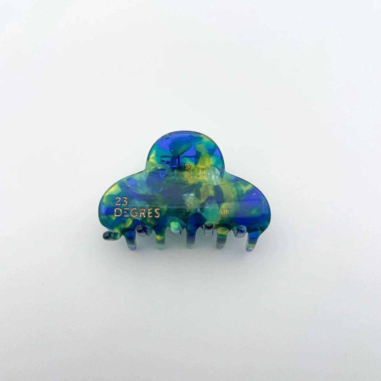 Petite pince à cheveux en forme de nuage à motifs écaille, coloris bleu et vert.