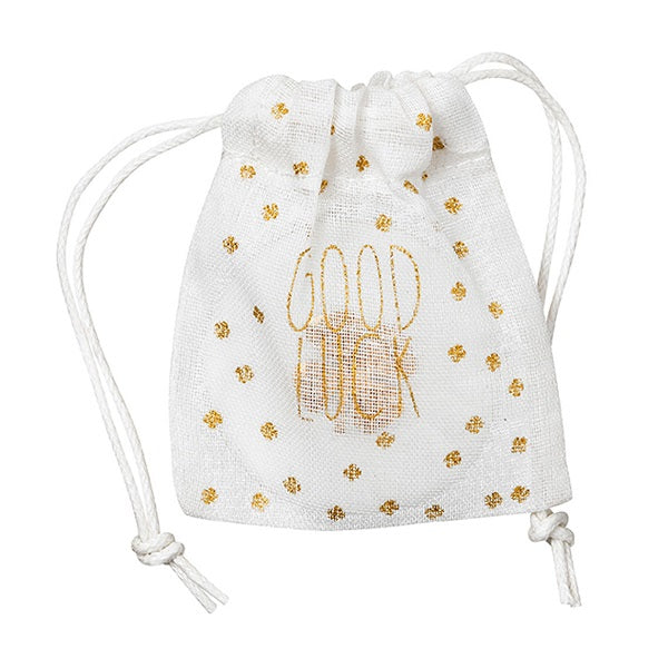 Petit pochon en coton blanc avec écriture dorée "Good luck" pour ranger sa pièce porte-bonheur en porcelaine.