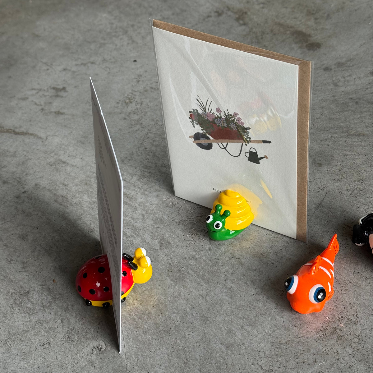 Porte-photos aimantés en forme d'animaux : poisson, chat, escargot et coccinelle.