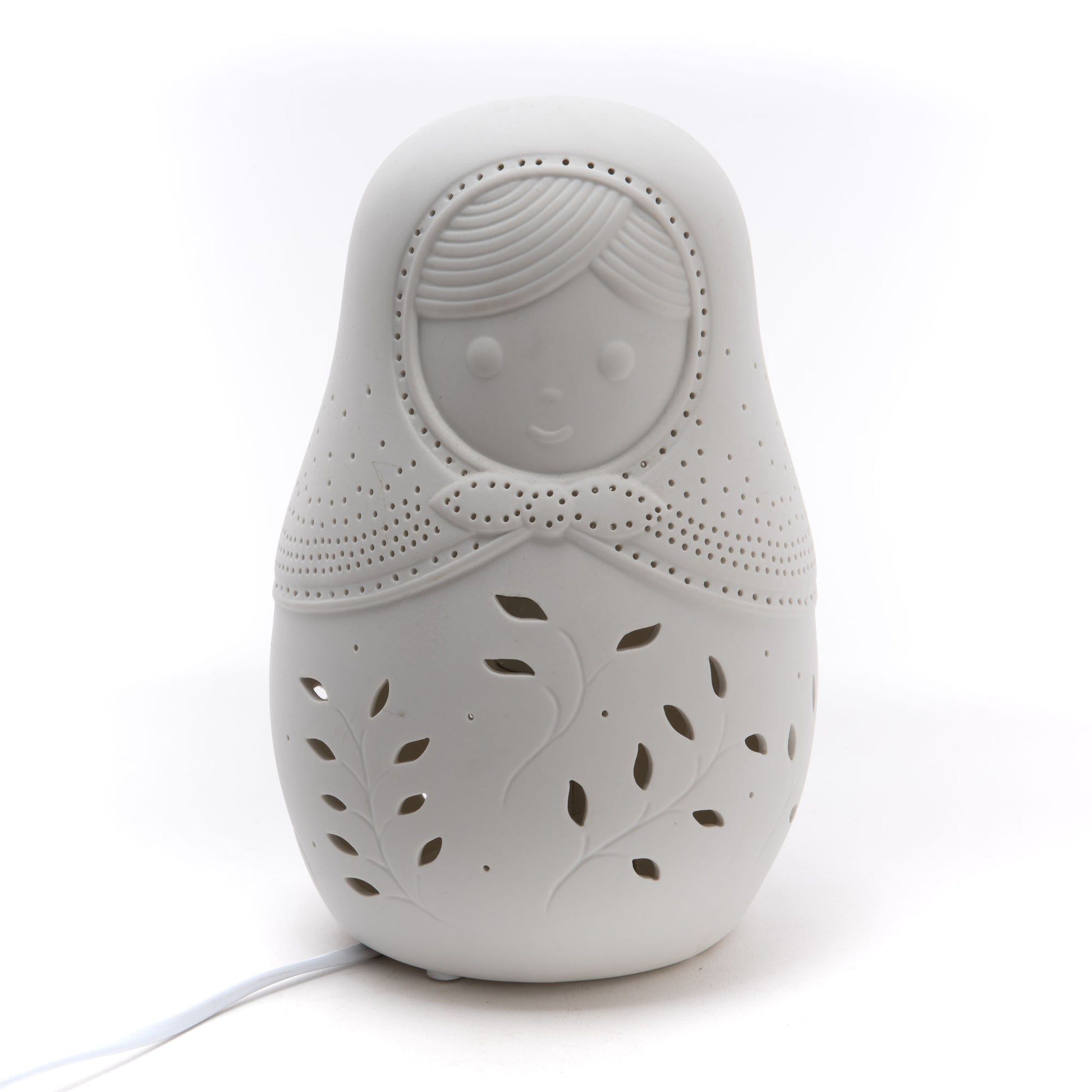 Veilleuse en porcelaine en forme de poupée russe.