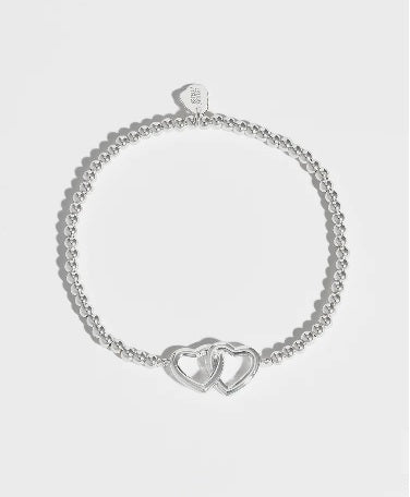 Bracelet avec coeurs entrelacés en plaqué argent