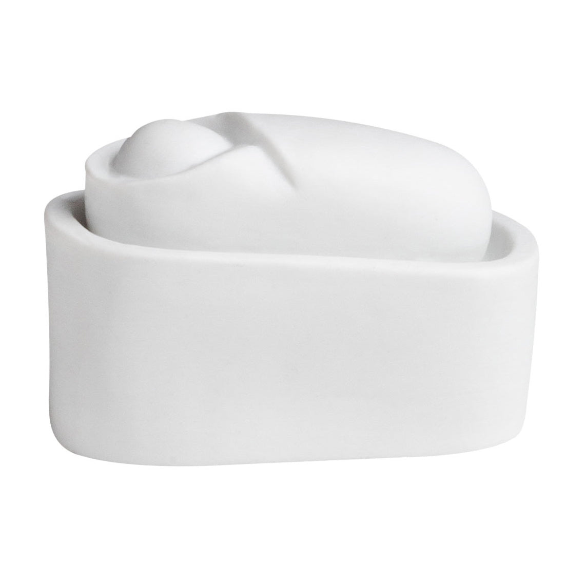 Sujet en porcelaine au dessin minimaliste représentant l'Enfant Jésus.